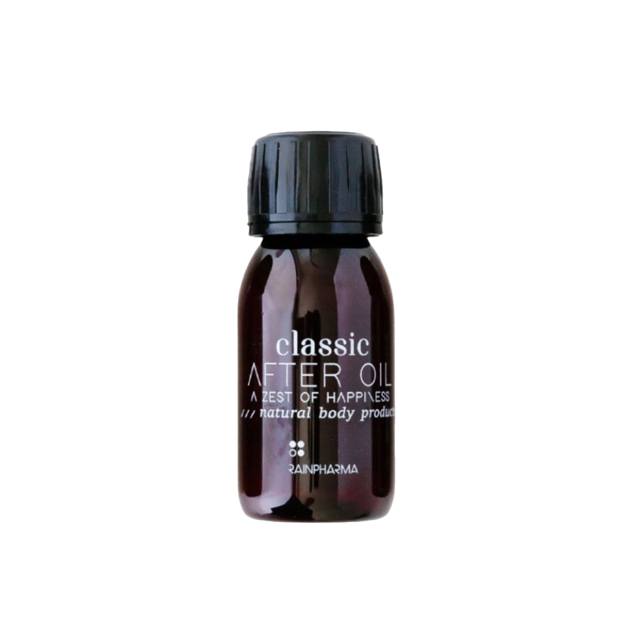 Een donker amberkleurig flesje van 60 ml met het label "Classic After Oil - Reisformaat" van RainPharma, heeft een zwarte dop met de tekst "A Zest of Happiness" en "Natural Body Product". Deze reinigingsolie reinigt en verfrist op natuurlijke wijze en zorgt voor een heldere en verkwikkende huid.
