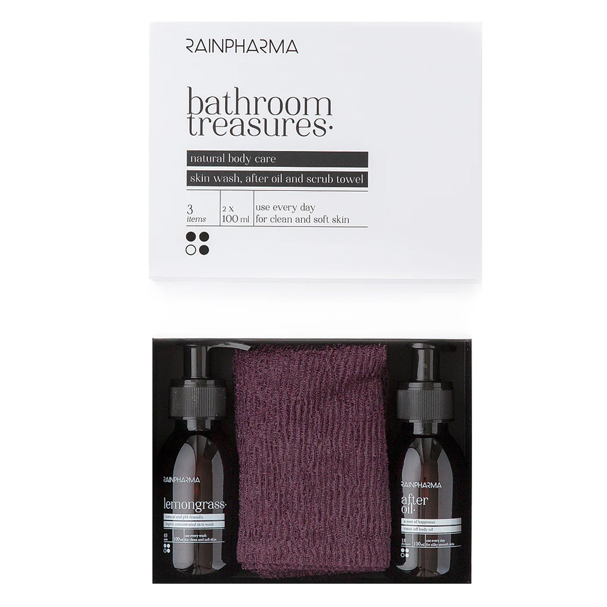 De RainPharma Shower Set - Bathroom Treasures bevat een paarse scrubhanddoek, 100% plantaardige Skin Wash Citroengras en After Oil. Verpakt in een stijlvolle wit-zwarte doos met natuurlijke geuren.
