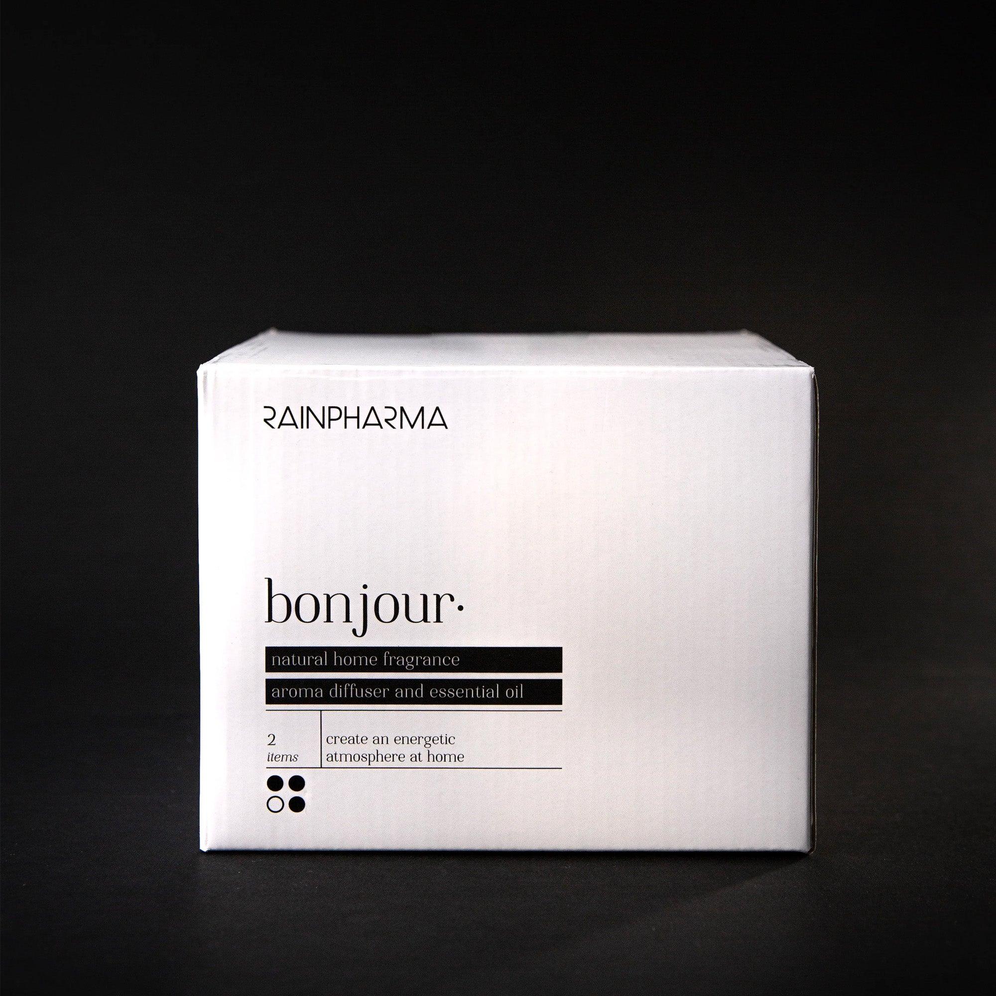 Een witte doos met zwarte tekst met de tekst "Aroma Diffuser Geschenkbox - Bonjour" van RainPharma.