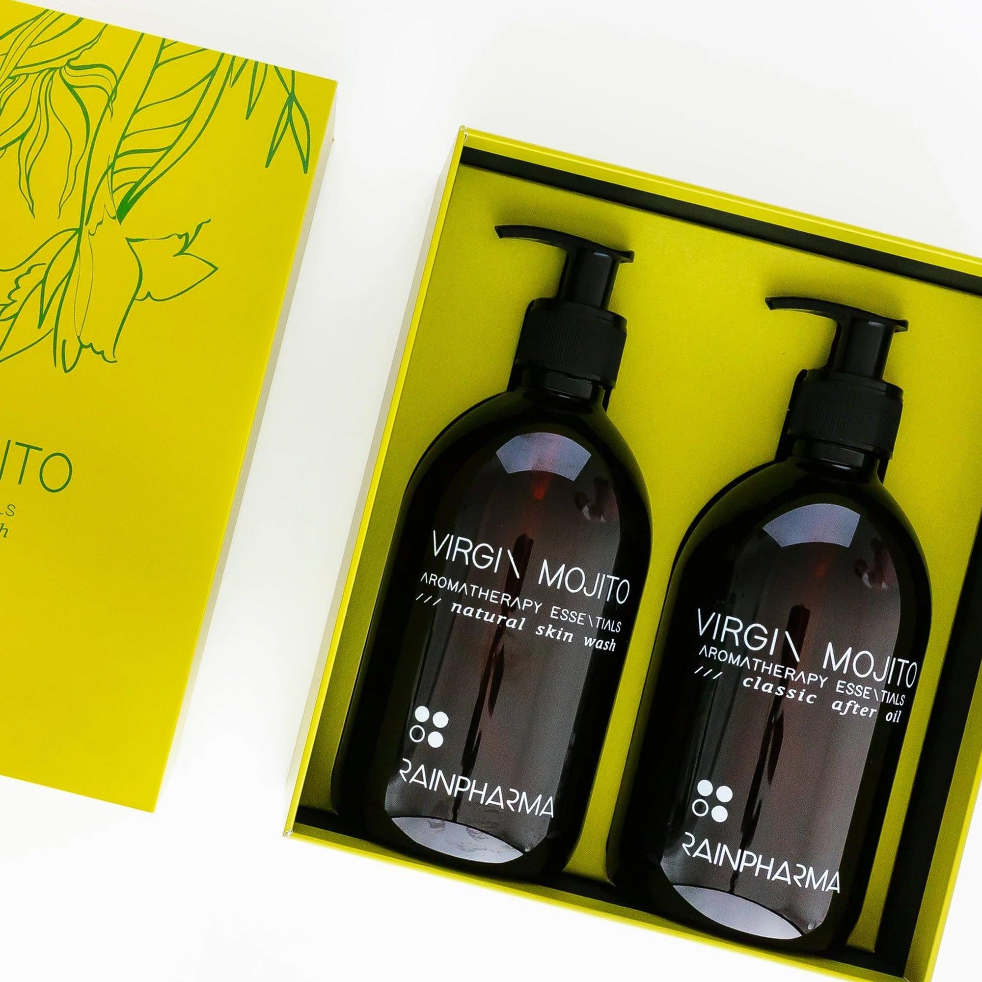 Twee flessen Doucheset van RainPharma - Virgin Mojito (Skin Wash + After Oil 500 ml), elegant verpakt in een gele geschenkdoos met botanische lijnkunst.