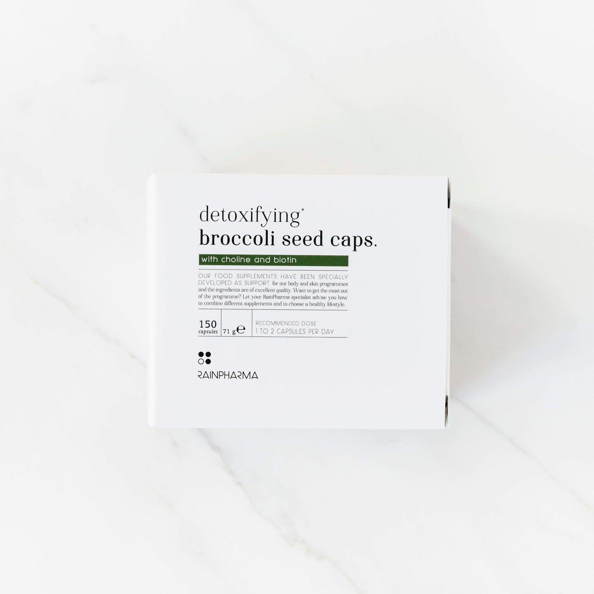 RainPharma Detoxifying Broccoli Seed Caps, 150 capsules met broccolizaadextract, choline, biotine en sulforafaan, afgebeeld in een wit doosje op een wit oppervlak.