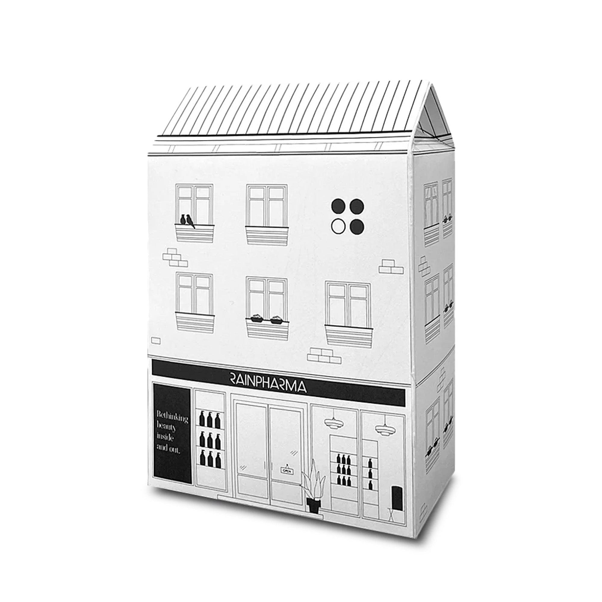De "Shop - Budget Gift set" van RainPharma wordt geleverd in een witte doos in de vorm van een winkeltje met drie verdiepingen, perfect om Skin Wash Lemongrass & Prebiotic Skin Lotion 60 ml cadeau te doen.