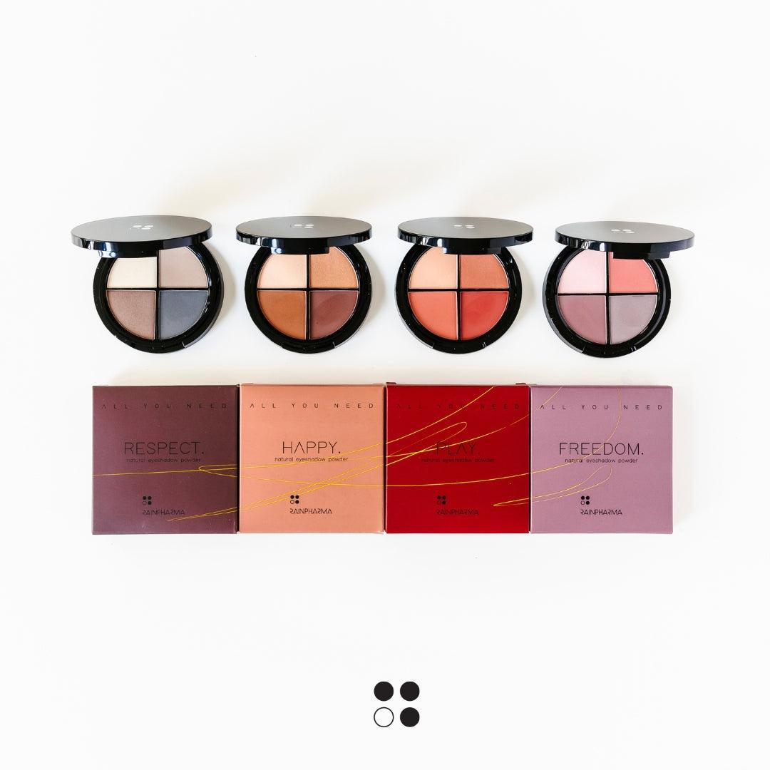 Vier ronde make-uppaletten van Puur Living, elk met vier tinten, worden weergegeven boven gekleurde dozen met de labels Respect, Happy, Play en Freedom. Op de doos staat het Cadeaubon Make-up verwenmoment voor twee op een witte achtergrond.