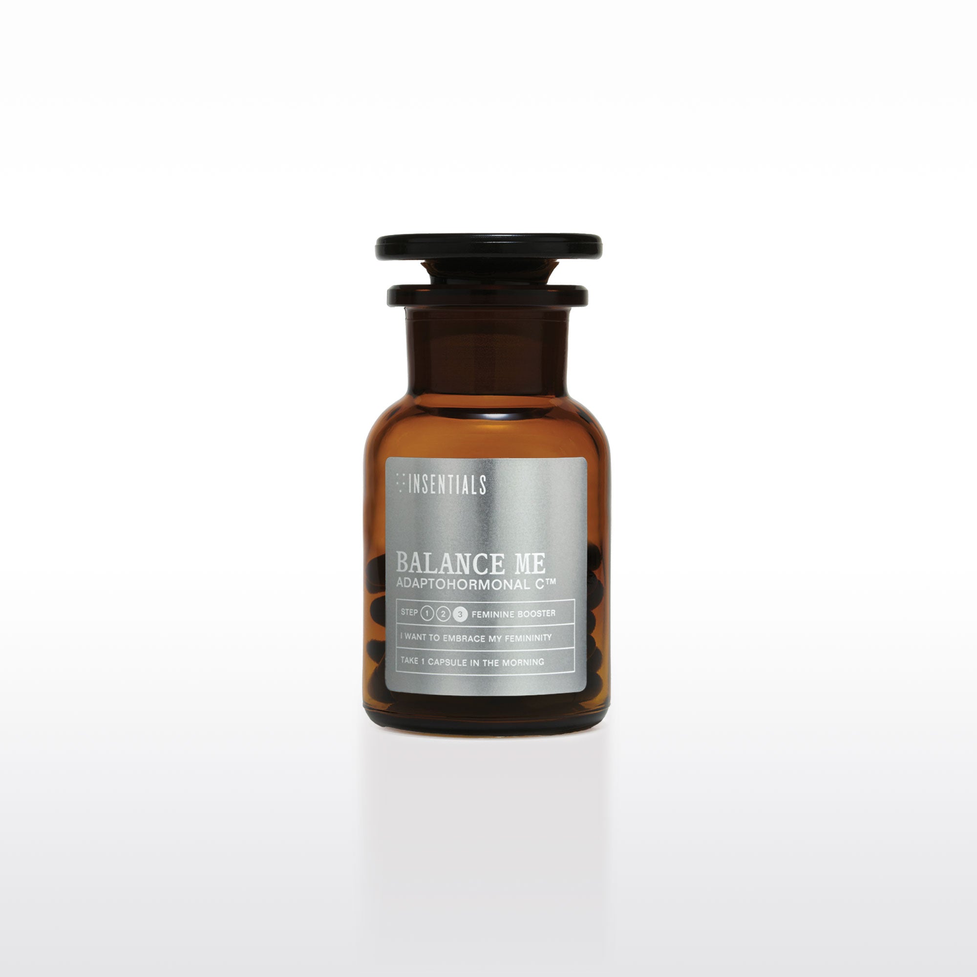 Een bruine glazen fles met het opschrift „Balance Me – Hormonale Balans &amp; Menopauze Support” van Insentials, met maca en rhodiola voor hormonale regulatie, doseringsinstructies, merklogo’s en een effen witte achtergrond.