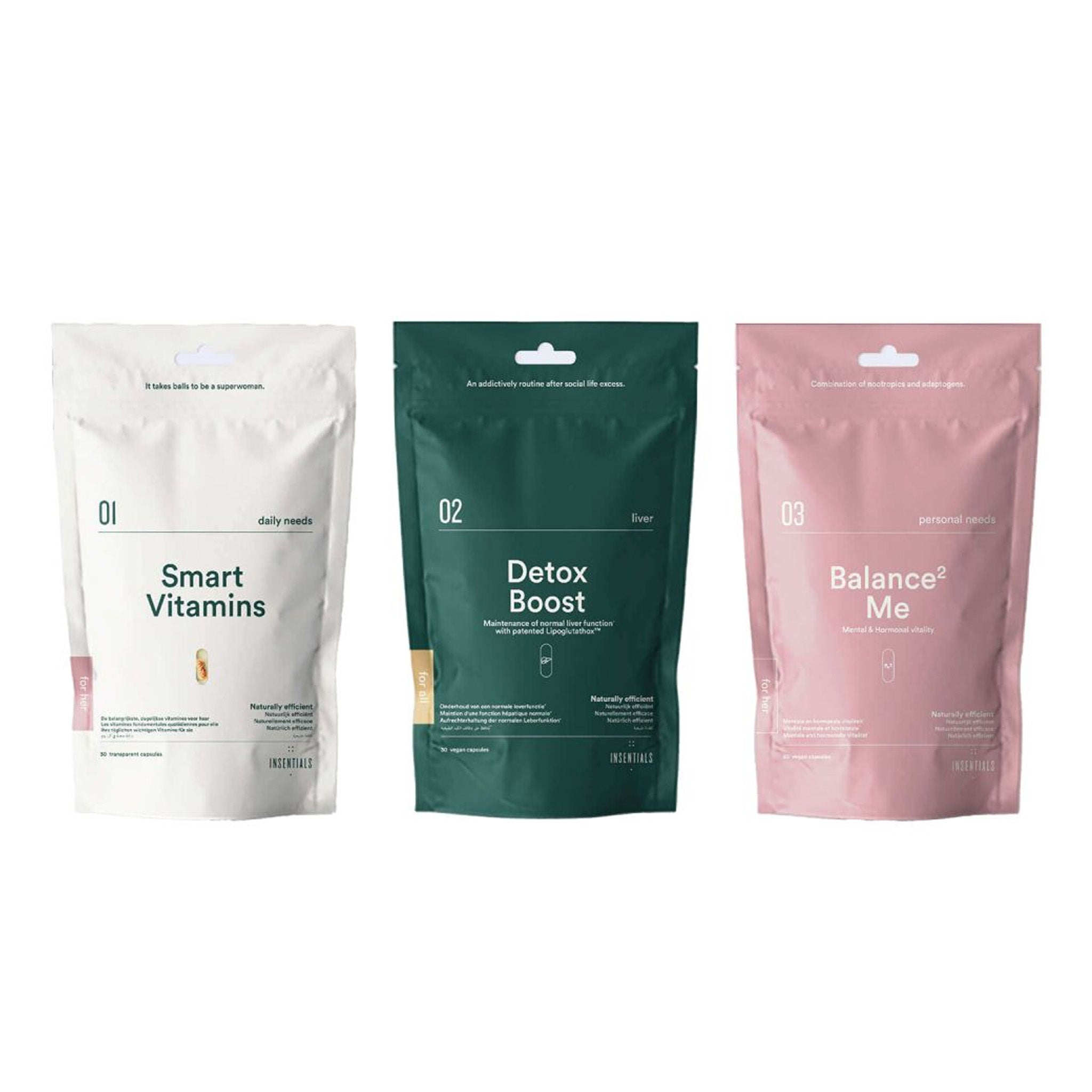 Drie hersluitbare Insentials - Smart Balance Pack-zakjes (Smart Vitamins, Detox Boost en Balance Me) met multivitaminen en detox-supplementen voor een goede hormoonbalans worden naast elkaar op een witte achtergrond weergegeven.