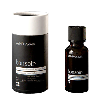 RainPharma Essential Oil Bonsoir set: aromatherapeutische benodigdheden in een cilindervormige doos, met een donker glazen flesje, zwarte dop en gelabelde verpakking.