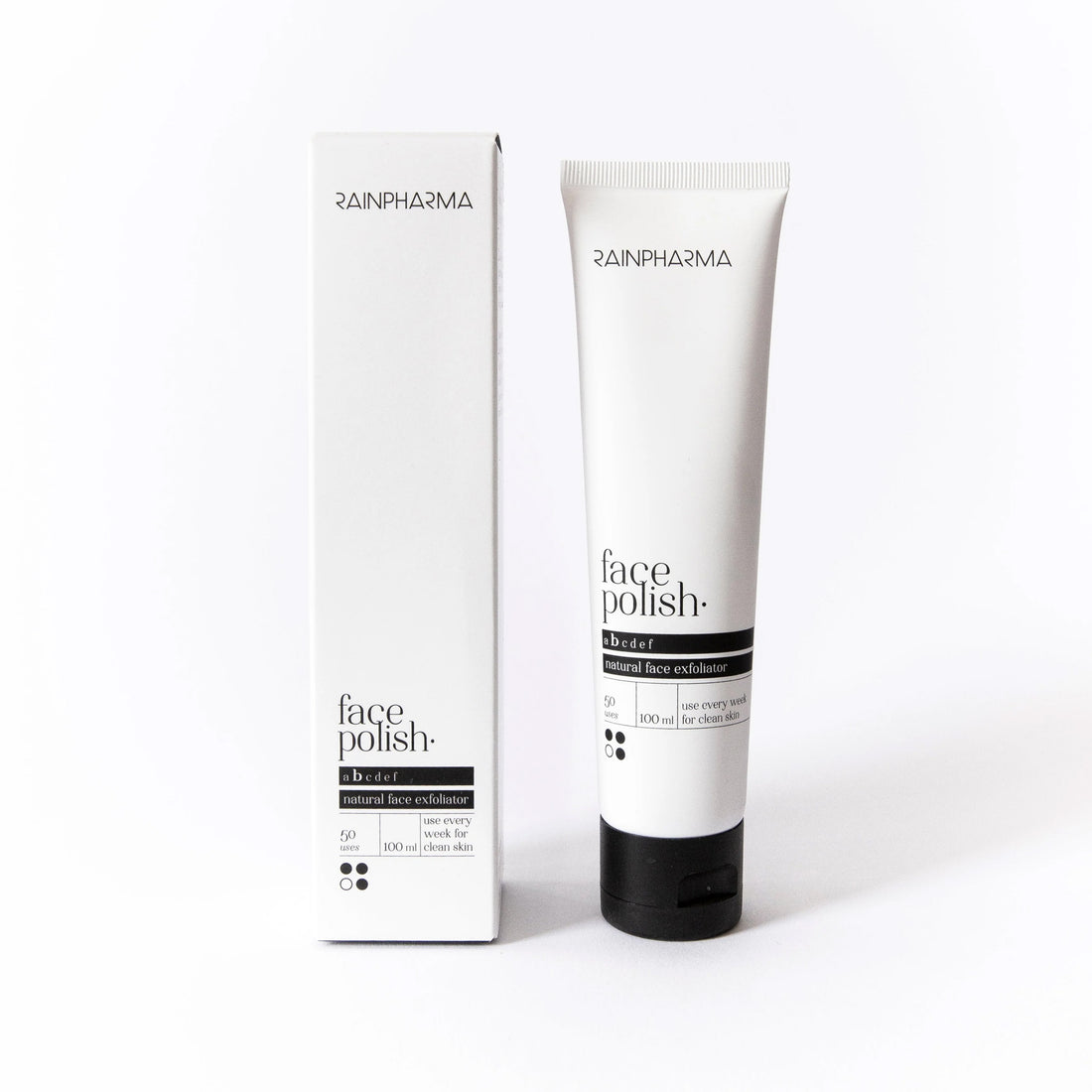 RainPharma Face Polish / Balming Face Polish (alle huidtypes) natuurlijke gezichtsverzorging: deze scrub van RainPharma is te zien in een tube met bijpassende verpakking op een witte achtergrond.