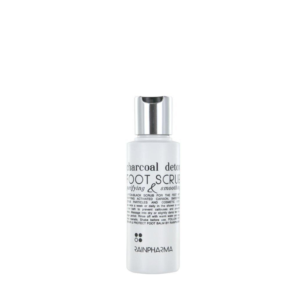 Een witte fles RainPharma Charcoal Detox Foot Scrub (100 ml) met een zilveren dop, met actieve kool in de plantaardige formule, is van voren afgebeeld op een effen witte achtergrond.