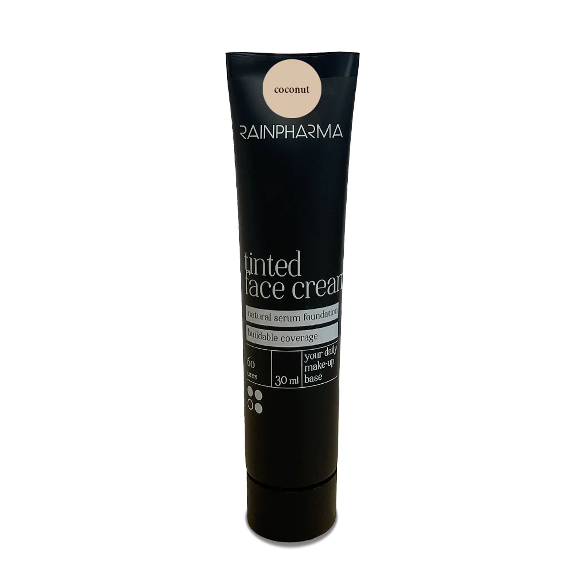 Een zwarte tube RainPharma Make Up - Tinted Face Cream in de kleur „coconut“, met een natuurlijke serumfoundation en een zonnefilter met SPF 15 voor extra bescherming. Deze veganistische formule biedt een opbouwbare dekking en is verkrijgbaar in een verpakking van 30 ml.