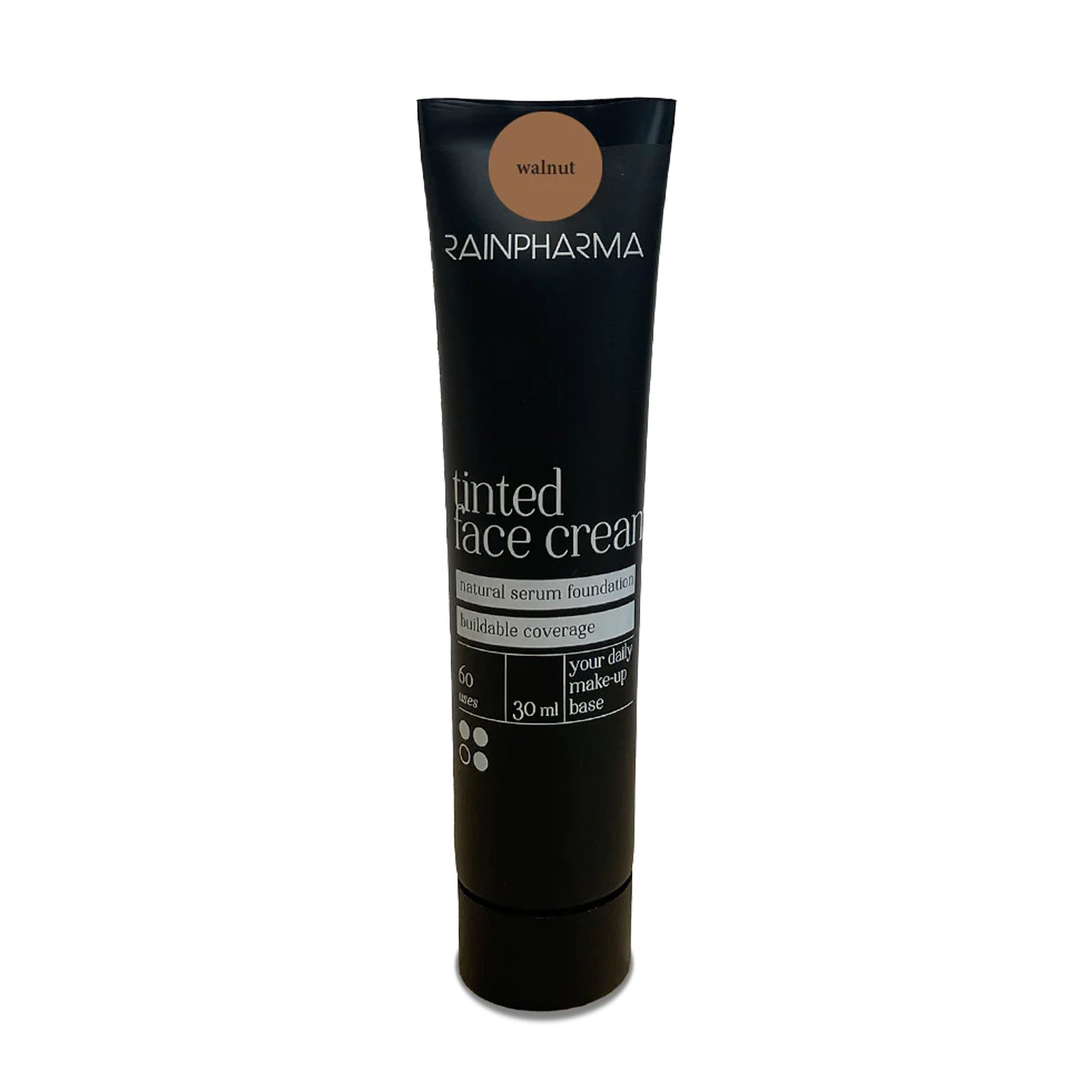 Een zwarte tube RainPharma Make Up - Getinte gezichtscrème in de kleur „walnut“, met een natuurlijke serumfoundation, een SPF15-zonnefilter en 30 ml veganistische getinte crème.